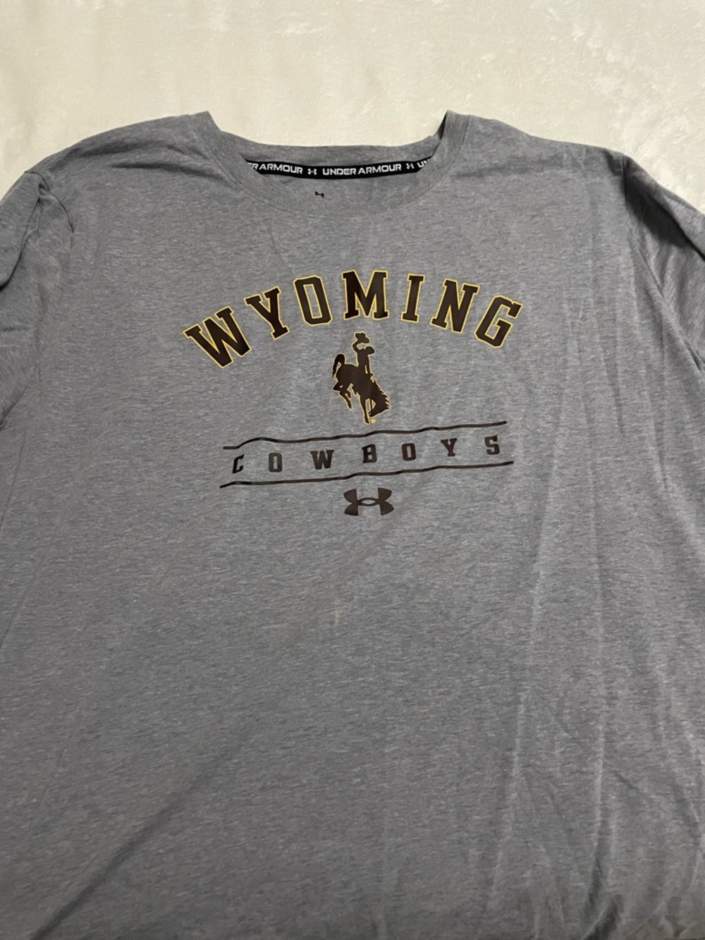 Under Armour Grey Wyoming Cowboys Logo Tee with Gold Accents
